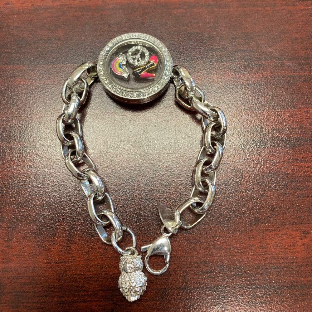 Origami Owl bracelet with 3 charms. Excellent condition…never worn